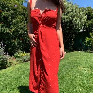 Red polka dot dress with front twist